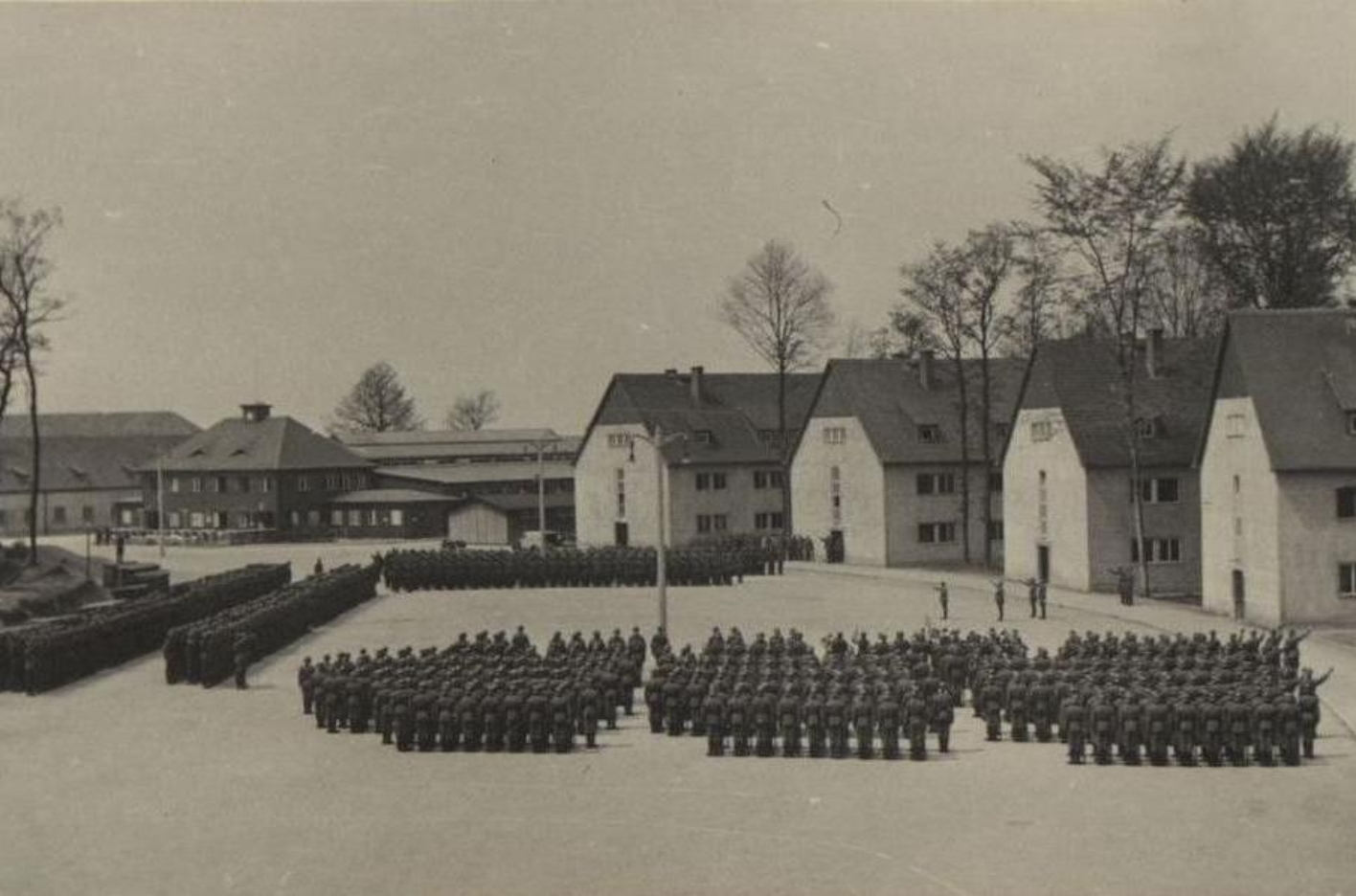 View of the SS Totenkopf Standarte 14 lined up on the parade ground in front of the Hundertschaftskasernen.
