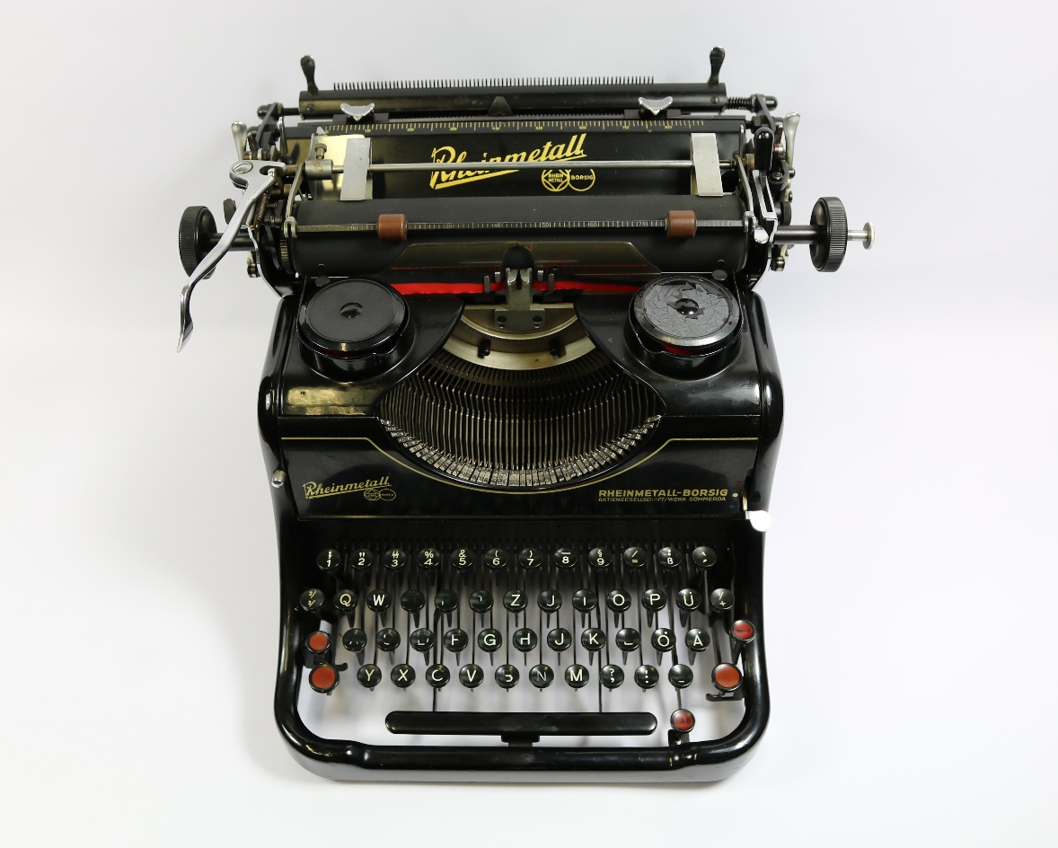 You can see a black typewriter, which was photographed from above.