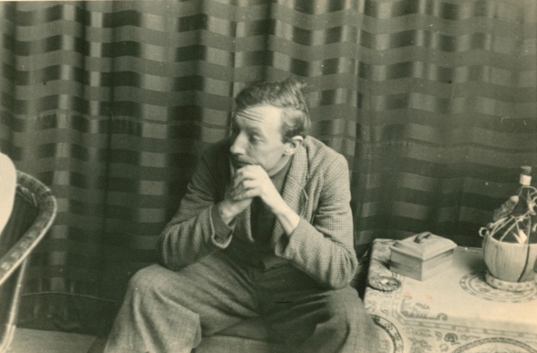 Private photo of Franz Monjau sitting, resting his arms on his legs.