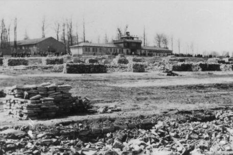 View of the gate building from the northeast. At the time the photo was taken, building material from the demolition of the wooden barracks is still on the camp site.