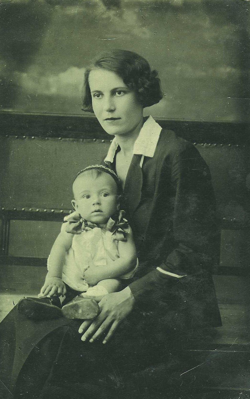 Portrait photo of Aleksandra Pavlovna Lavrik with a baby on her lap