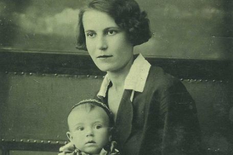 Portrait photo of Aleksandra Pavlovna Lavrik with a baby on her lap