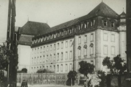 Photo of a large, four-story city building. 